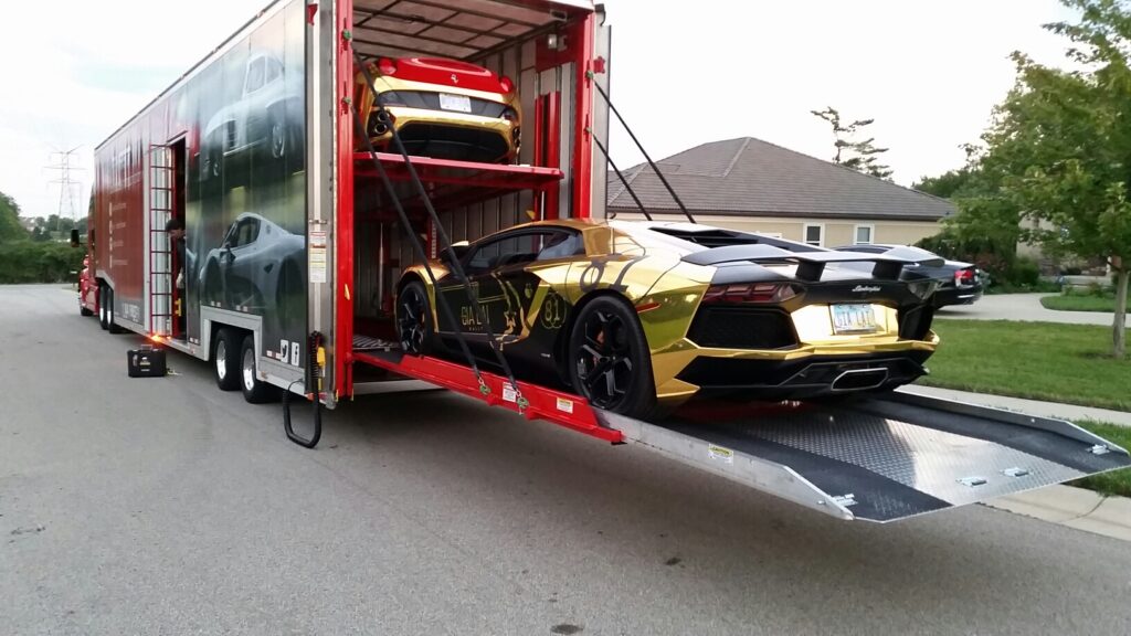 expensive car being lifted into the trailer