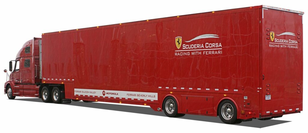 large red trailer that reads Ferrari