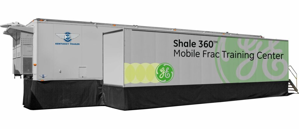 grey trailer with green logo