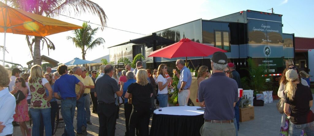 large group of people socializing at an outdoor party