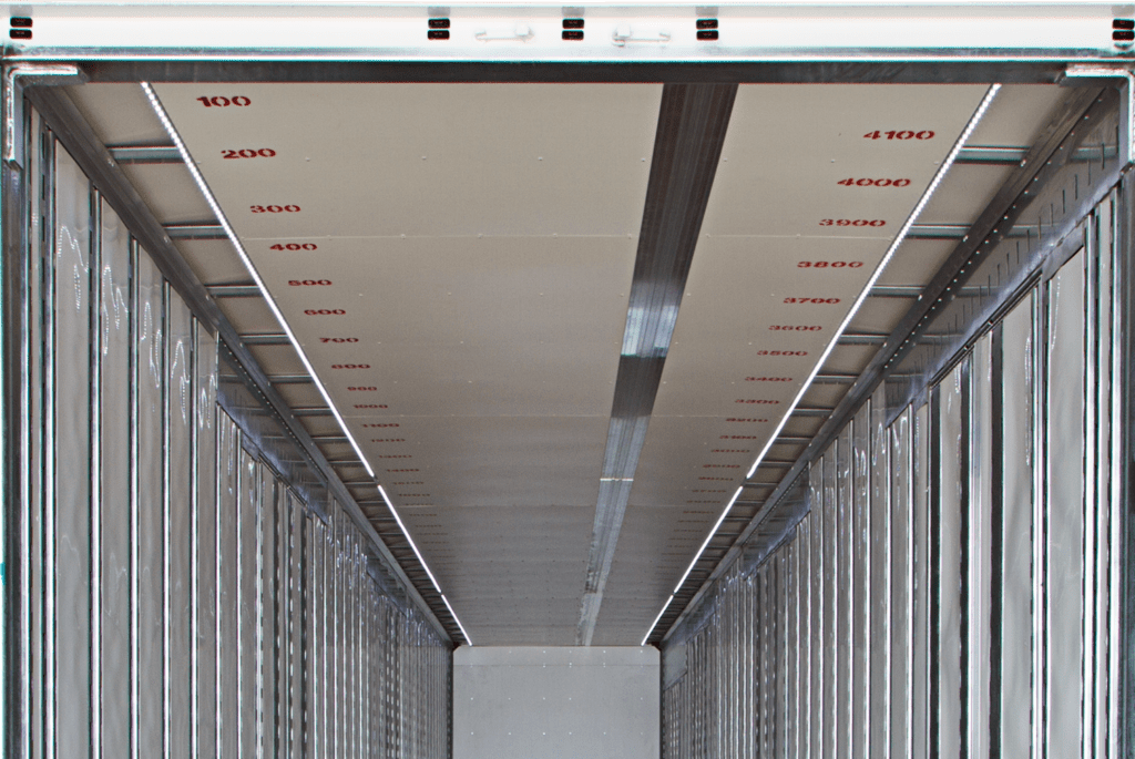 interior ceiling of white, blue, and yellow climate van trailer that says united