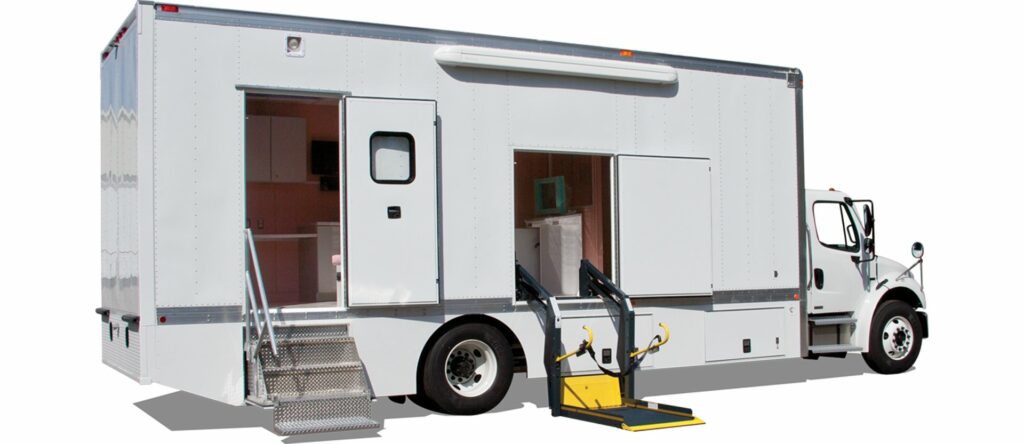 white mobile medical trailer with doors open