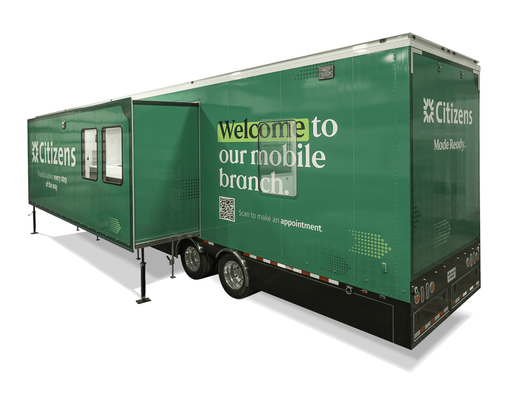 green trailer with yellow text